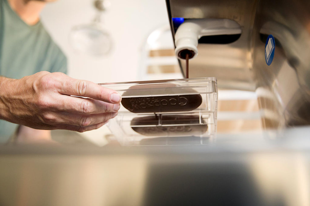 Goodnow Farms Asochivite Chocolate being poured into molds