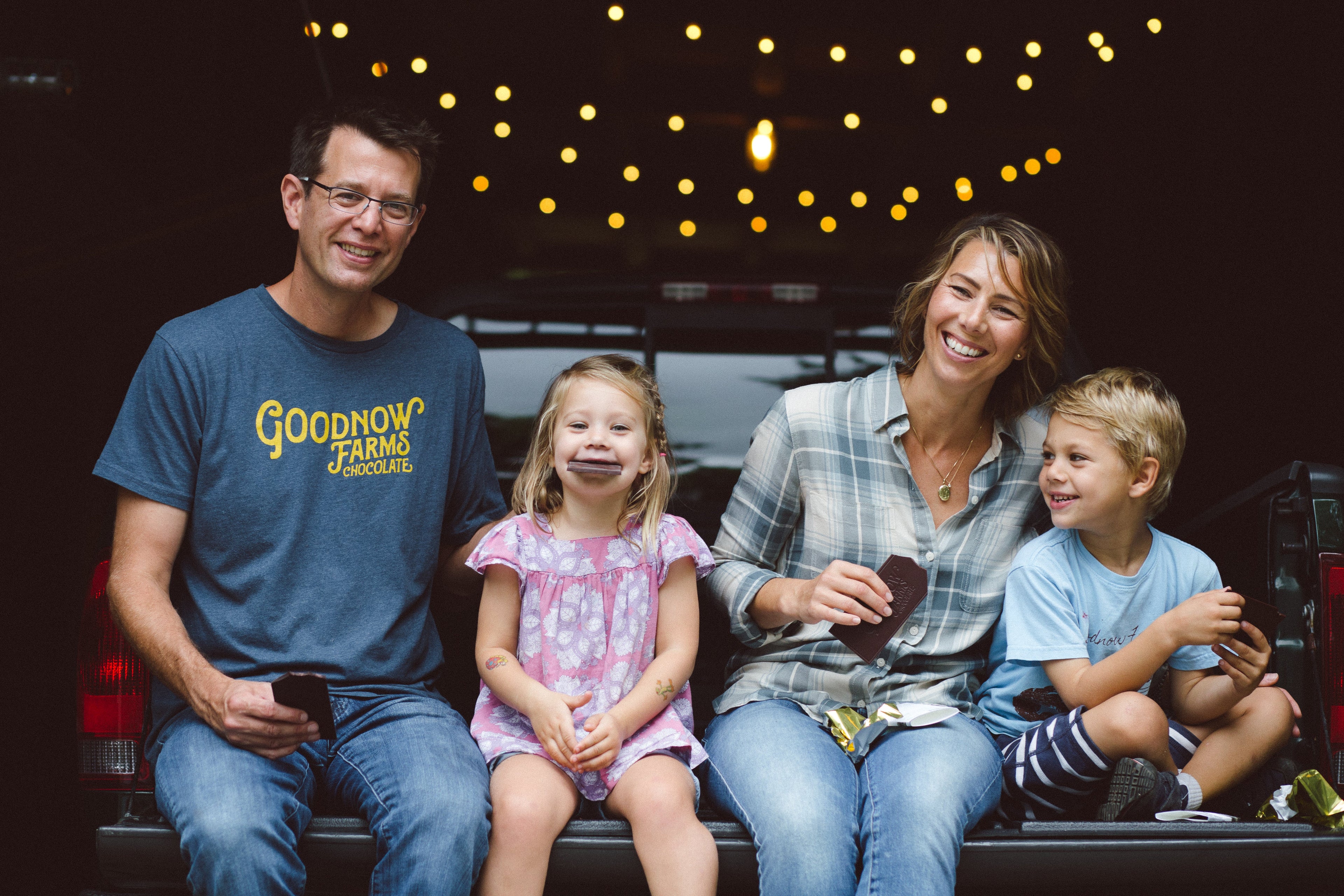 Goodnow Farms cofounders enjoy Esmeraldas dark chocolate bar with their family
