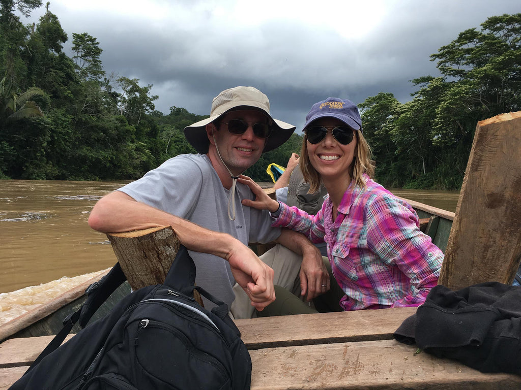 Goodnow Farms Cofounders Tom and Monica travel in a boat along the Ucayali River in Peru to visit local cacao farms