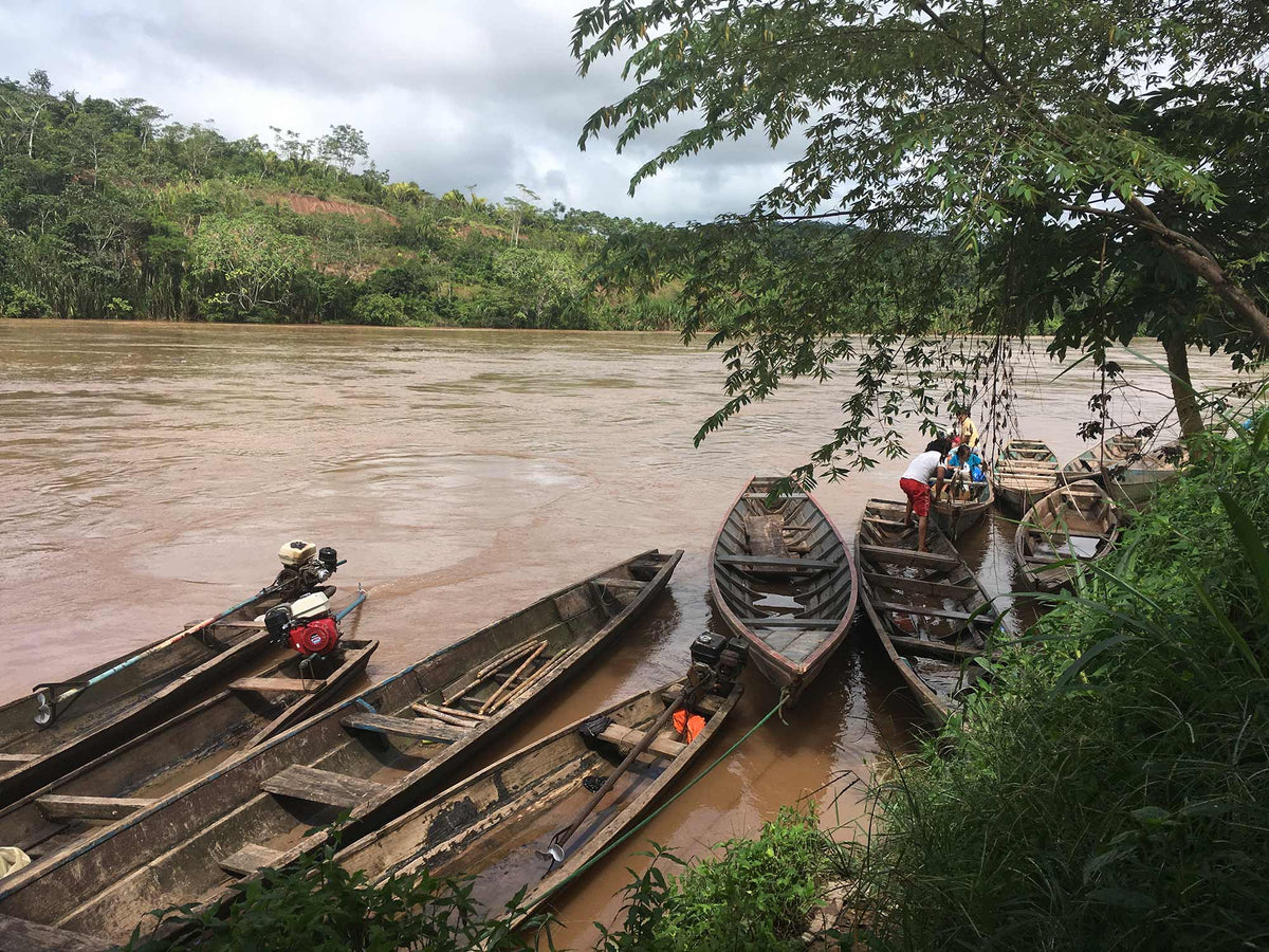 Boats are the main form of transportation for farmers who live along the river.
